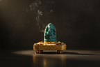 Turquoise Carved Ganesha Idol with Gold Embellished Base