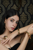 Ornate Gold-Toned Bangle with Colorful Stones