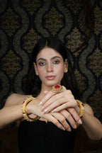 Intricate Gold-Toned Bangle with Ruby & Pearl Accents