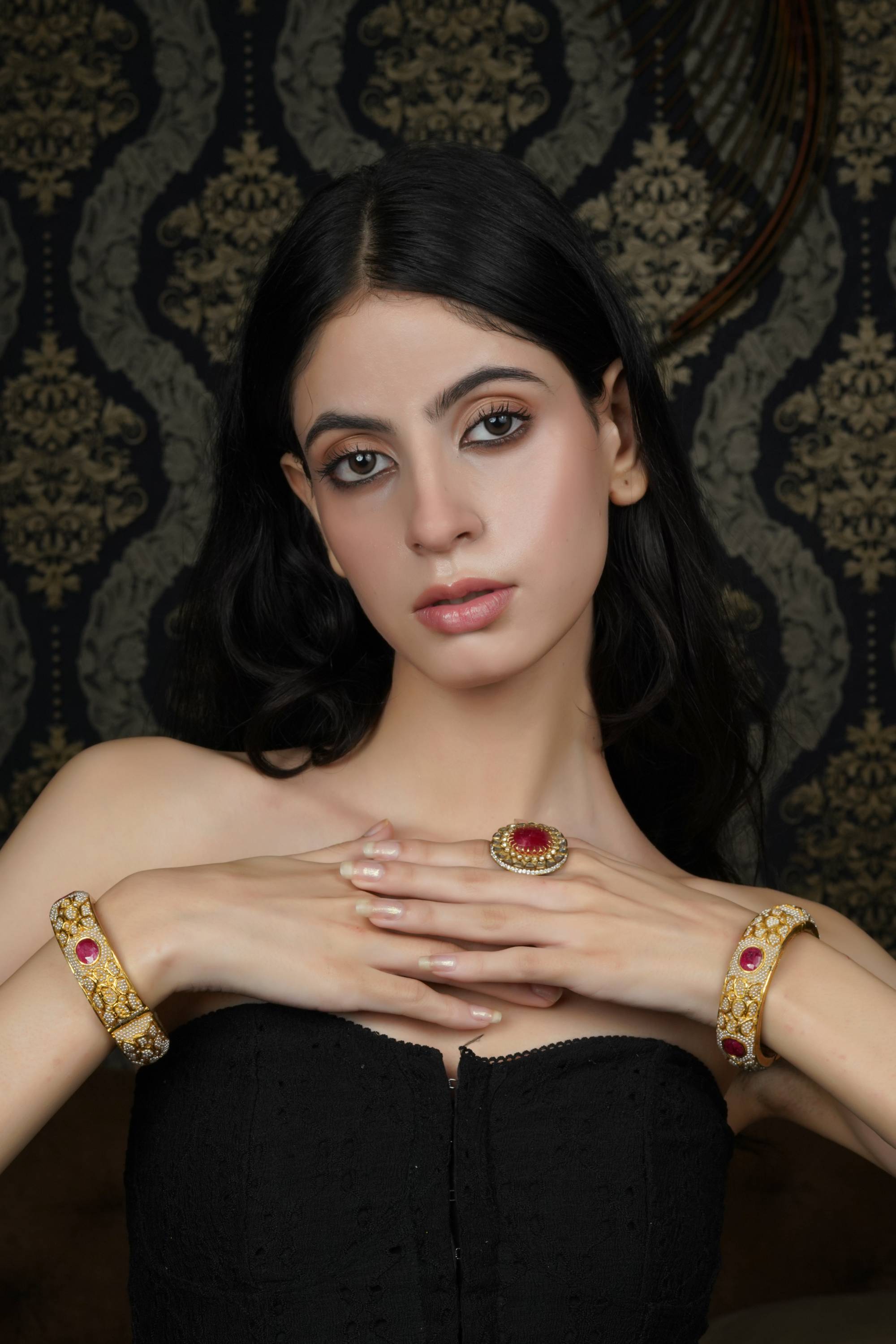 Intricate Gold-Toned Bangle with Ruby & Pearl Accents