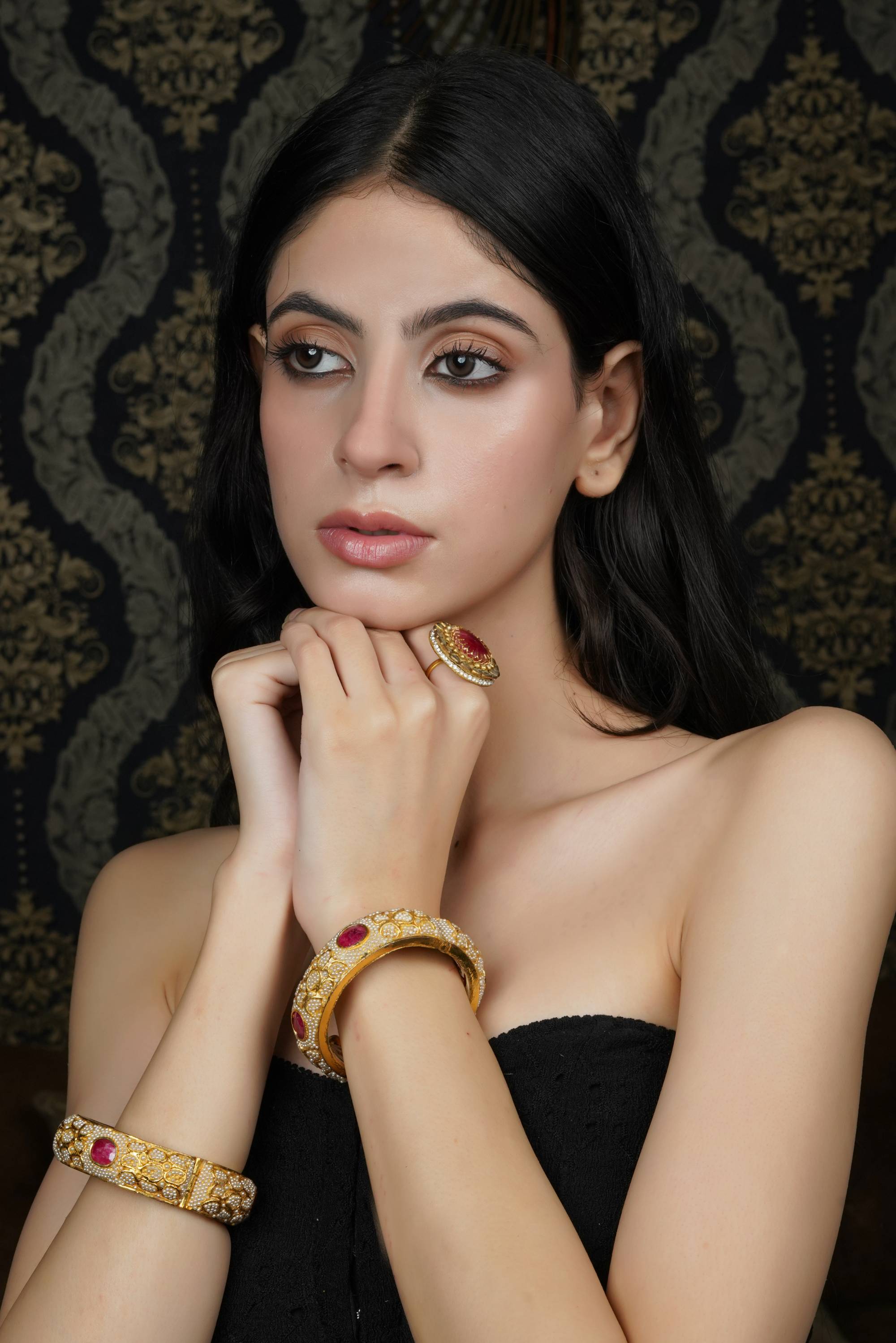 Intricate Gold-Toned Bangle with Ruby & Pearl Accents