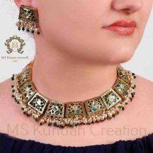 Gold Foil Patra, Emerald and round Kundan in fine carved necklace